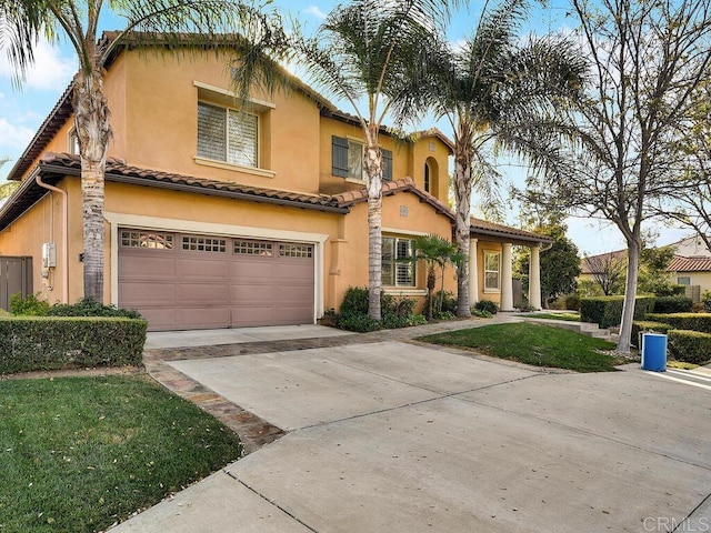 mediterranean / spanish-style home featuring a garage