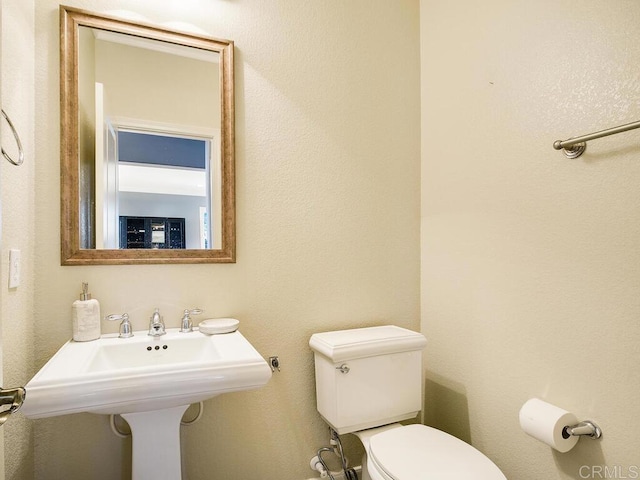 bathroom with toilet and sink