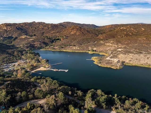 birds eye view of property featuring a water and mountain view