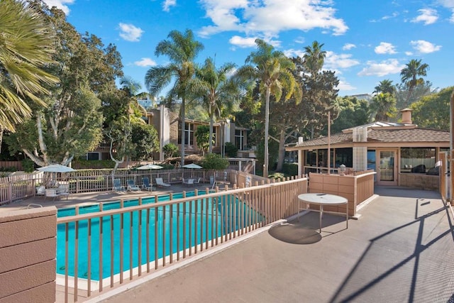 view of swimming pool with a patio area