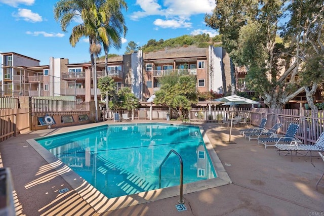 view of swimming pool with a patio