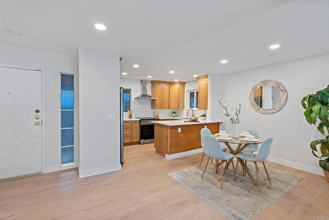 dining room with light wood-type flooring and sink