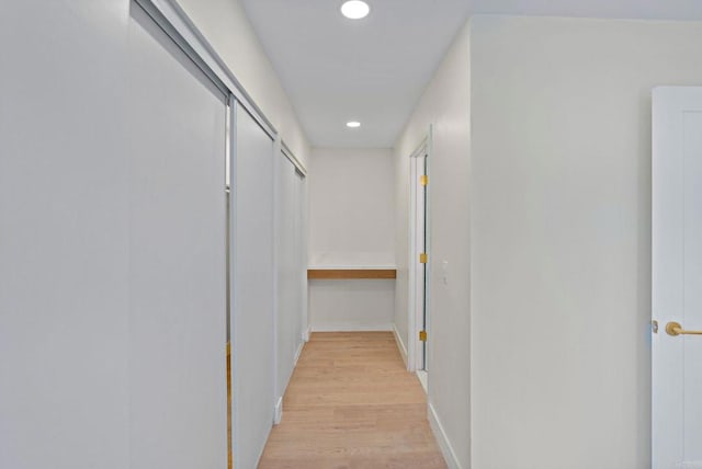 hallway with light wood-type flooring