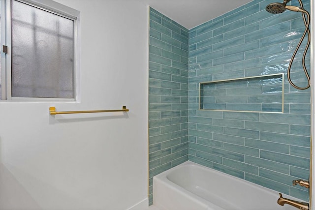 bathroom with tiled shower / bath combo