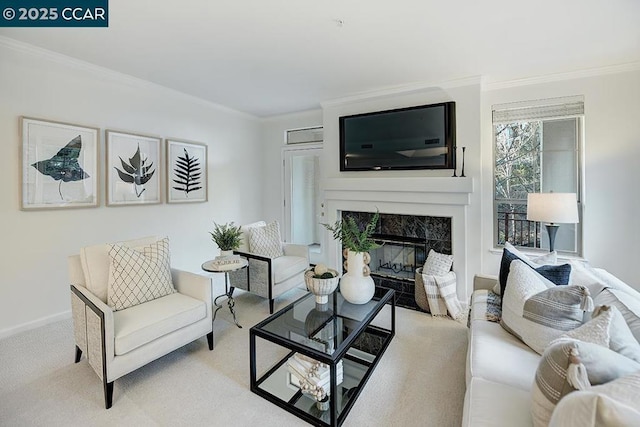 carpeted living room with ornamental molding and a tiled fireplace