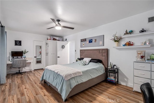 bedroom featuring ceiling fan and light hardwood / wood-style floors