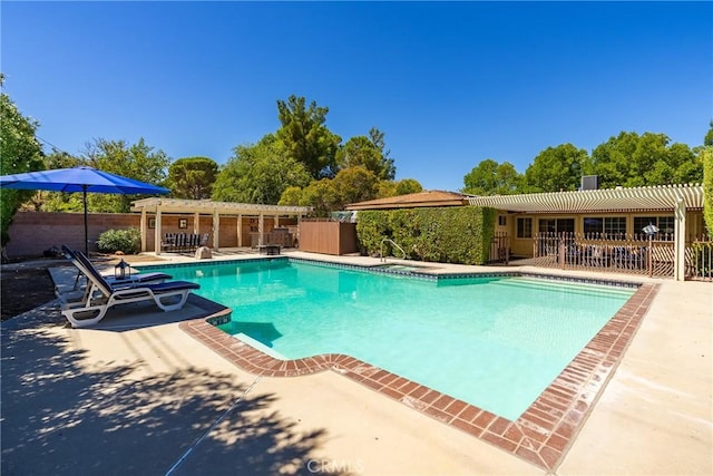 pool featuring a patio and fence