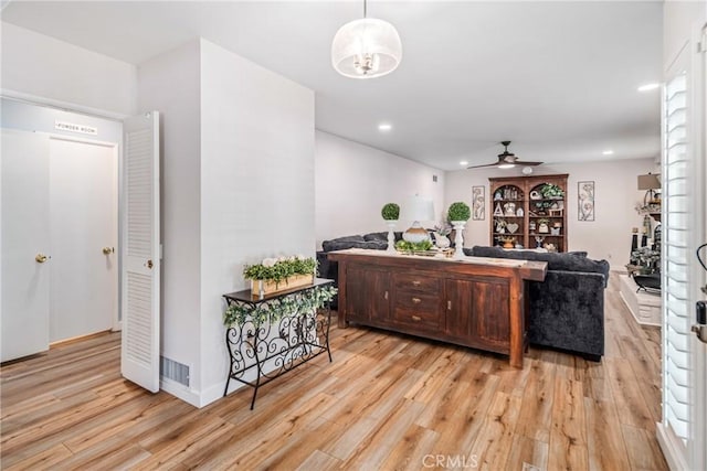 living room with recessed lighting, a ceiling fan, and light wood finished floors
