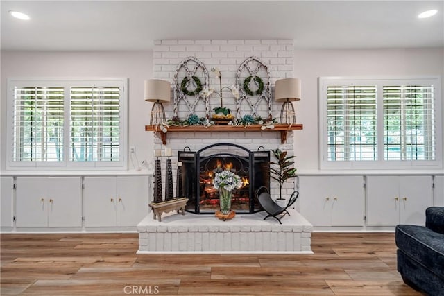 sitting room featuring light hardwood / wood-style floors and a fireplace