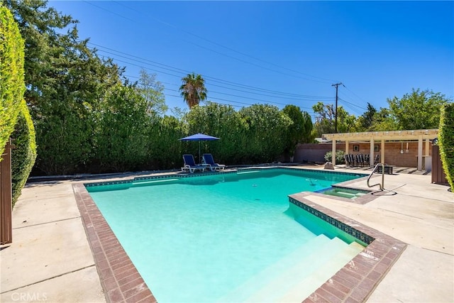 outdoor pool with a pergola and a patio area