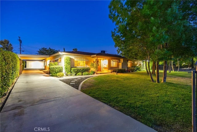 ranch-style home featuring a front yard and a garage