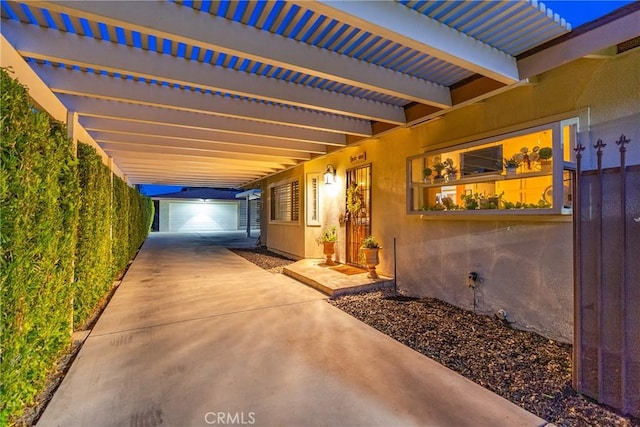 view of patio / terrace featuring an outbuilding and a garage