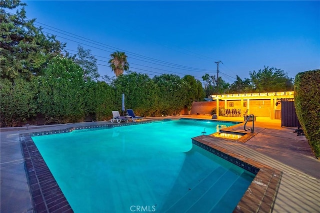 outdoor pool featuring fence and a deck