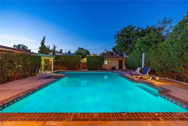 view of swimming pool featuring a patio area