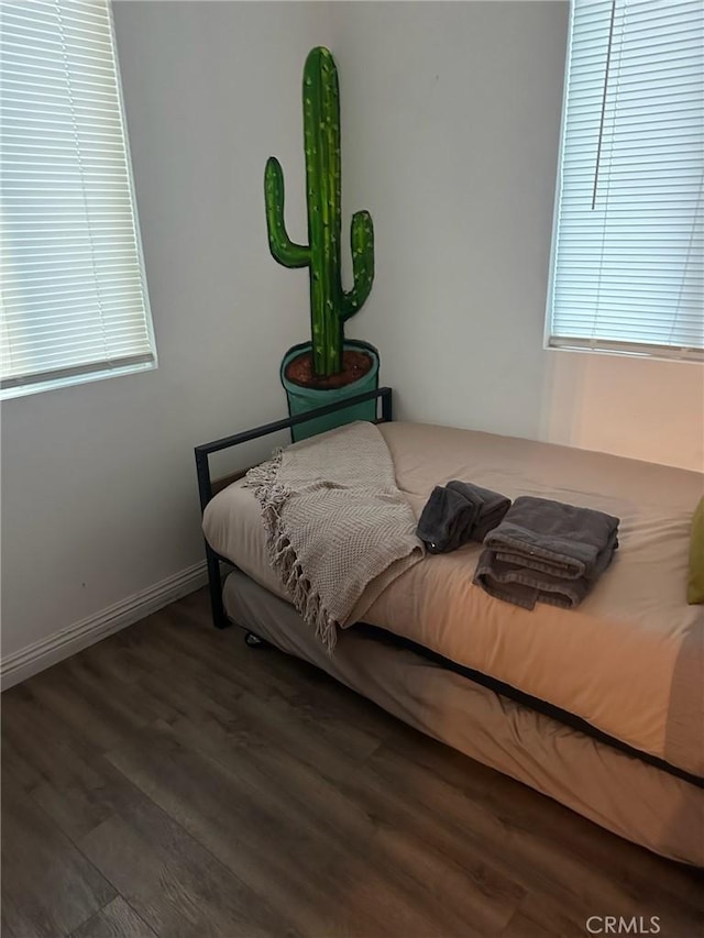 bedroom featuring dark hardwood / wood-style flooring