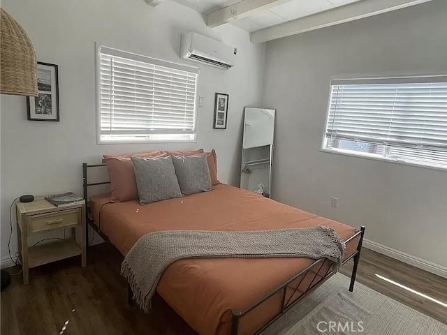 bedroom featuring beam ceiling, dark hardwood / wood-style floors, and an AC wall unit