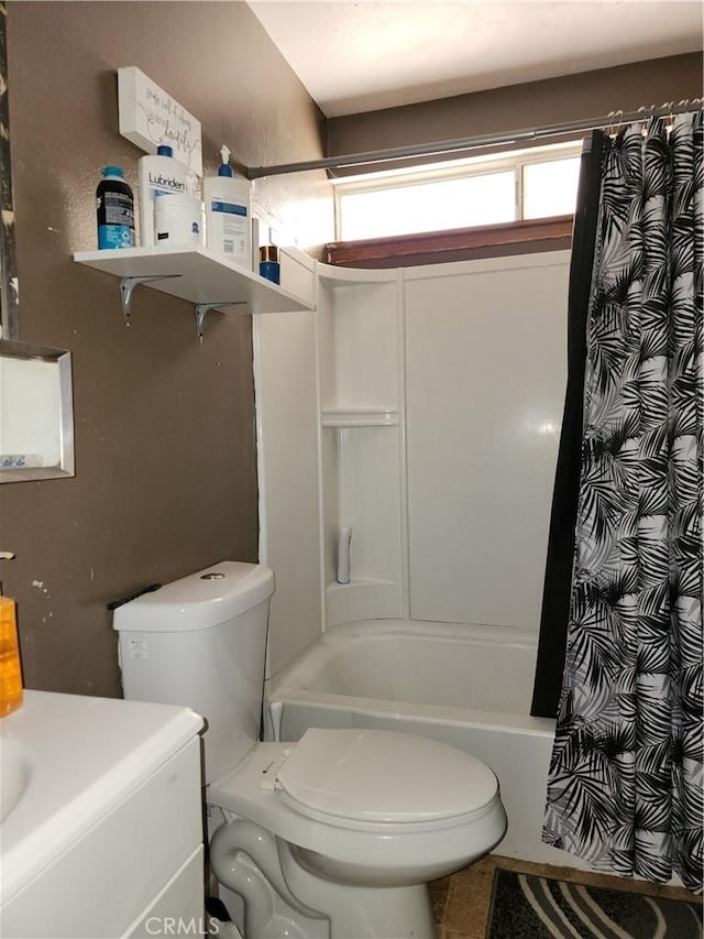 full bathroom with vanity, shower / tub combo, tile patterned floors, and toilet