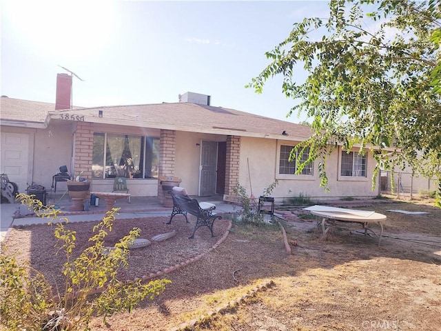 rear view of house featuring a patio