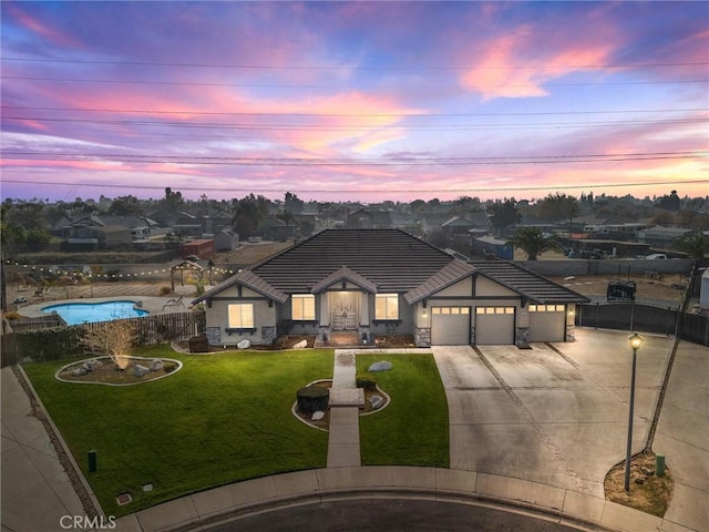 view of front of house with a lawn and a garage