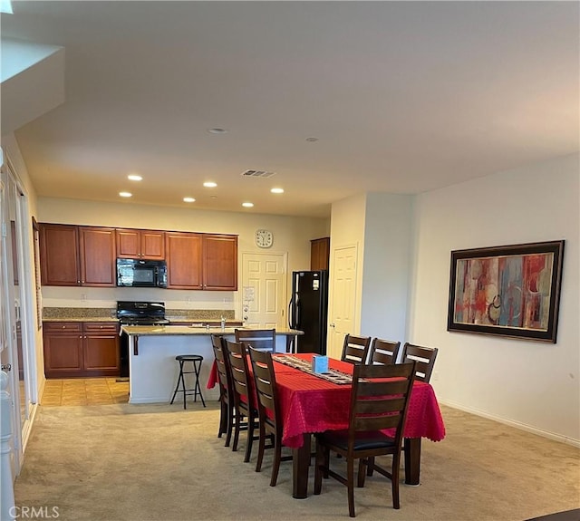 view of carpeted dining area