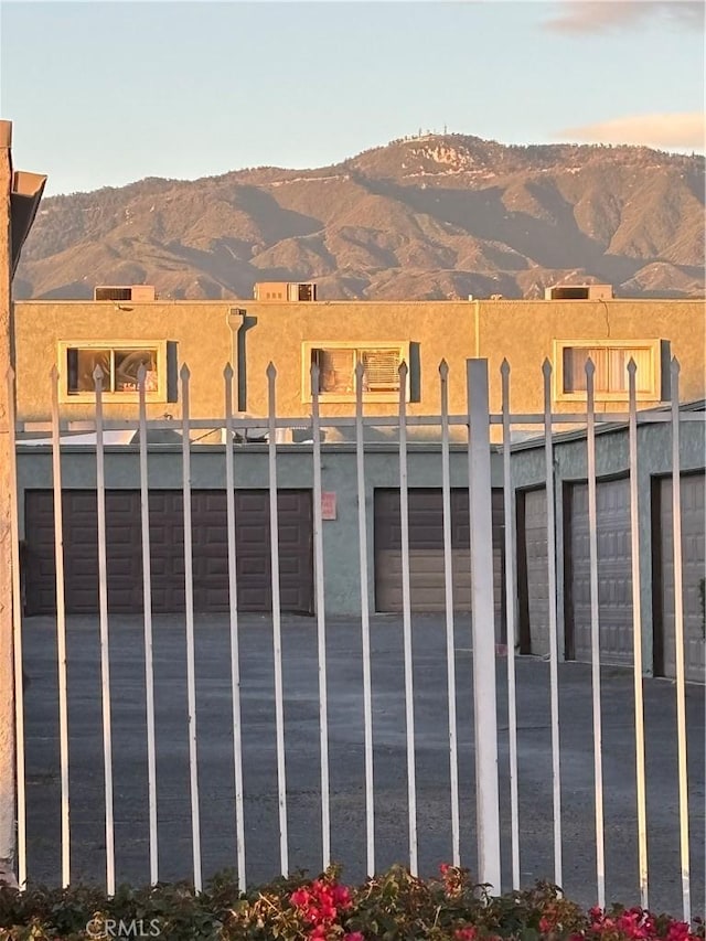 view of gate with a mountain view