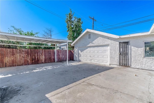 view of side of property with a garage