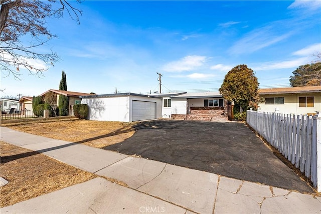 ranch-style house featuring a garage