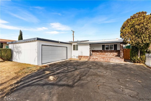 single story home with a garage