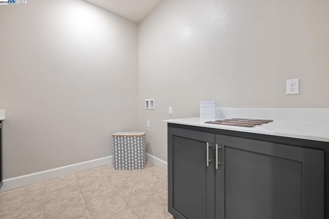 laundry area with washer hookup and cabinets