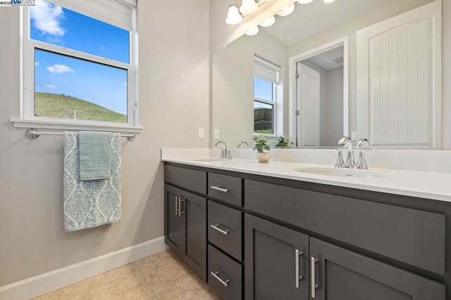 bathroom with vanity and tile patterned flooring