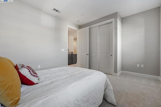 carpeted bedroom featuring a closet