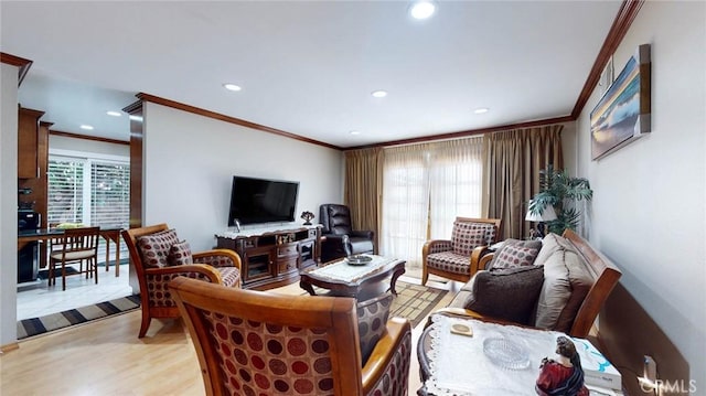 living room featuring ornamental molding and light hardwood / wood-style floors