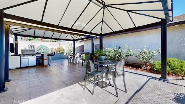 view of patio featuring a grill and an outdoor kitchen