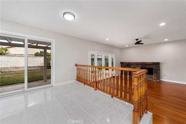 hall featuring recessed lighting, light wood finished floors, and baseboards