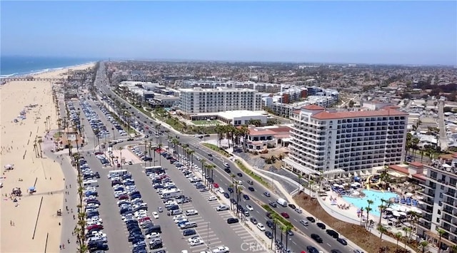 birds eye view of property with a view of the beach and a water view