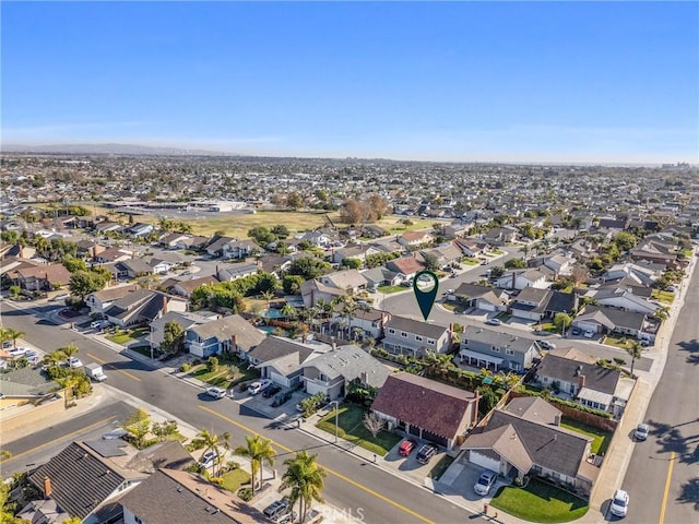 birds eye view of property with a residential view