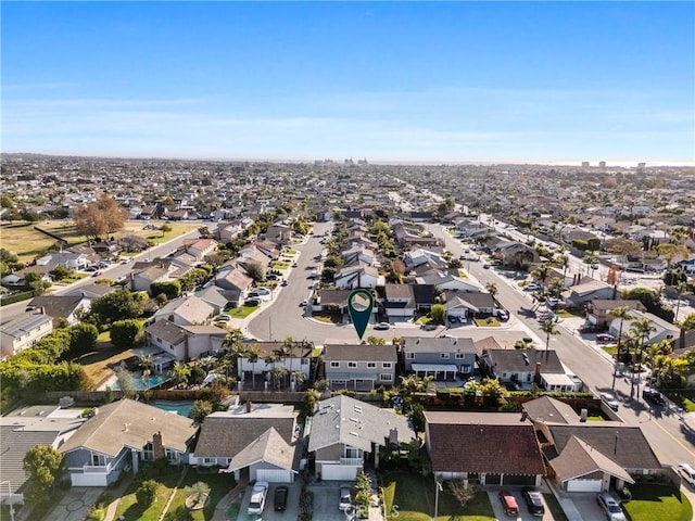 birds eye view of property with a residential view