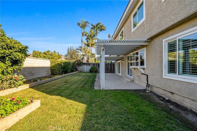 view of yard featuring a patio area, a fenced backyard, and a pergola