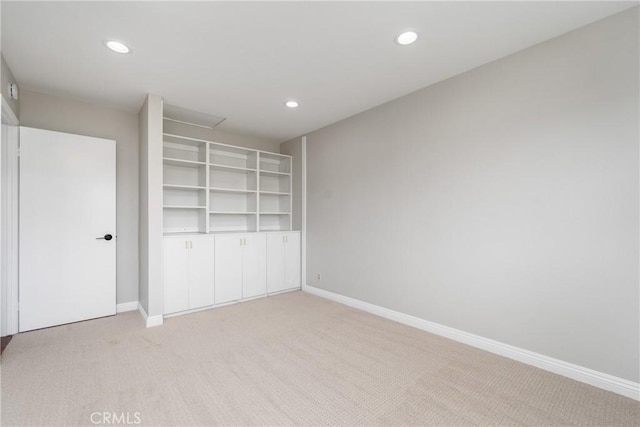 unfurnished bedroom featuring light colored carpet