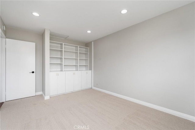 unfurnished bedroom featuring recessed lighting, light colored carpet, and baseboards