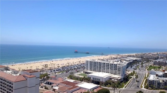 bird's eye view with a water view and a view of the beach