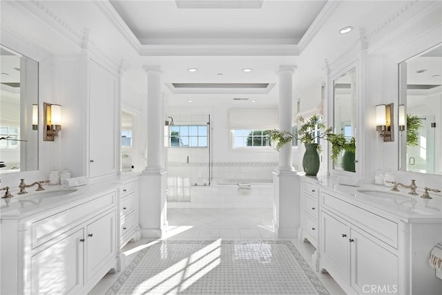 bathroom with decorative columns, separate shower and tub, tile patterned floors, ornamental molding, and vanity