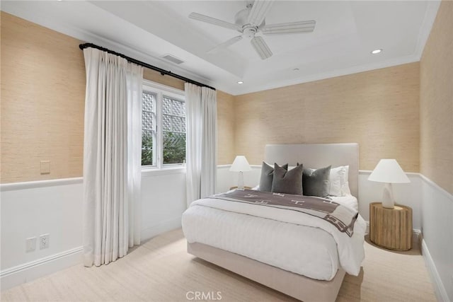 bedroom with ceiling fan and ornamental molding