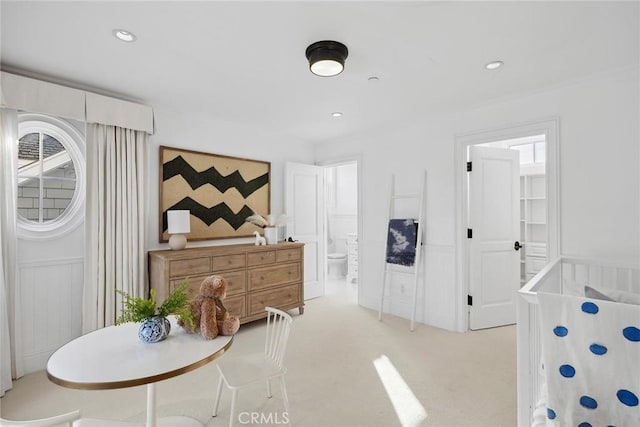 carpeted bedroom featuring connected bathroom