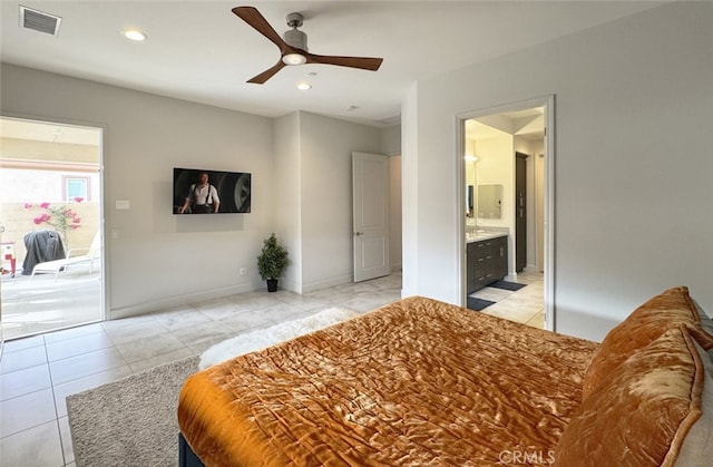 tiled bedroom with ceiling fan and connected bathroom