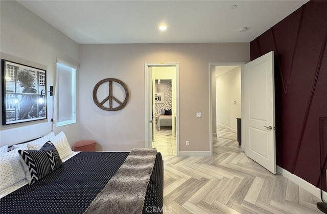 bedroom with light parquet flooring