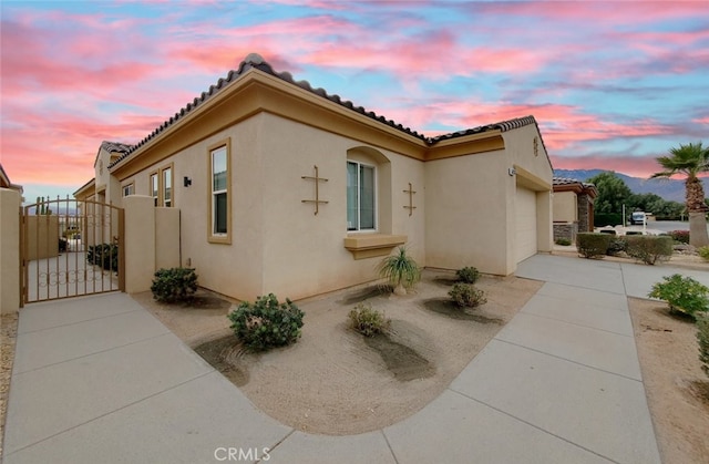 view of property exterior at dusk