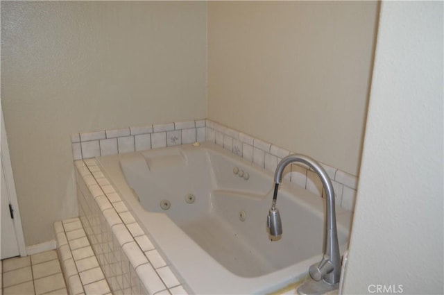 bathroom featuring tiled bath and tile patterned floors