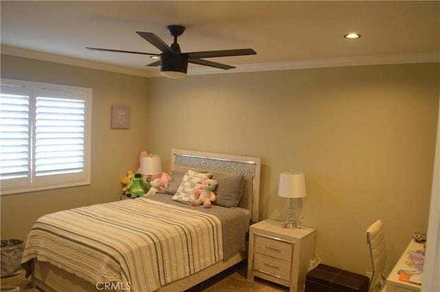 bedroom featuring ceiling fan and ornamental molding