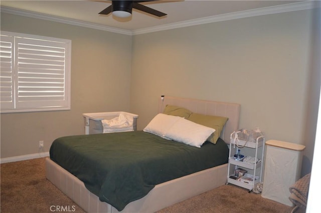 bedroom featuring ceiling fan, carpet, and crown molding